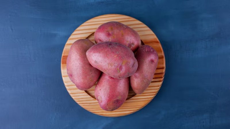 Batata doce em cima de tábua