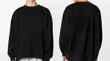 pessoa posando com moletom oversized.